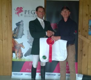 Joseph Murphy been presented his first prize by Declan Cullen of Pegus Horse Feed  